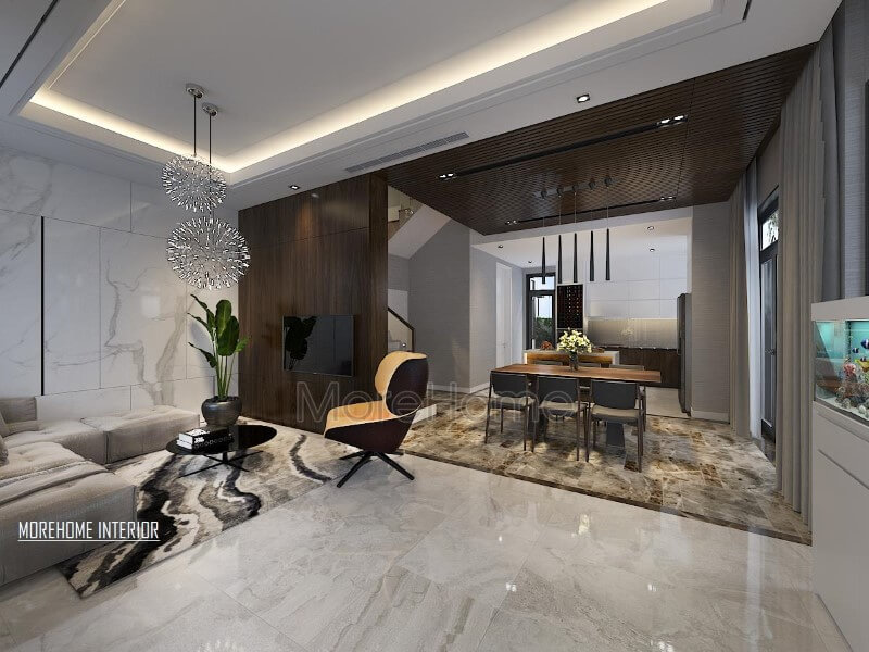 Điểm nhấn ấn tượng giữa gỗ ốp tường cùng đá lát sàn cao cấp tạo nên ánh nhìn hiện đại, sang trọng cho phòng khách liền bếp ăn. Thiết kế nội thất