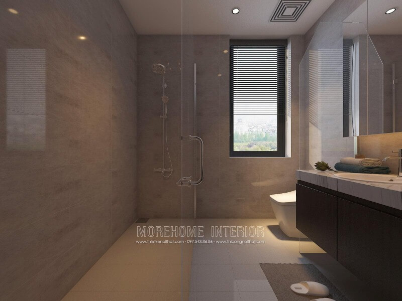 Thiết kế nội thất phòng tắm nhỏ đẹp sang trọng với vách tắm kính 135 độ song song với không gian vệ sinh từ tủ, gương và bồn cầu. Thiết kế nội thất