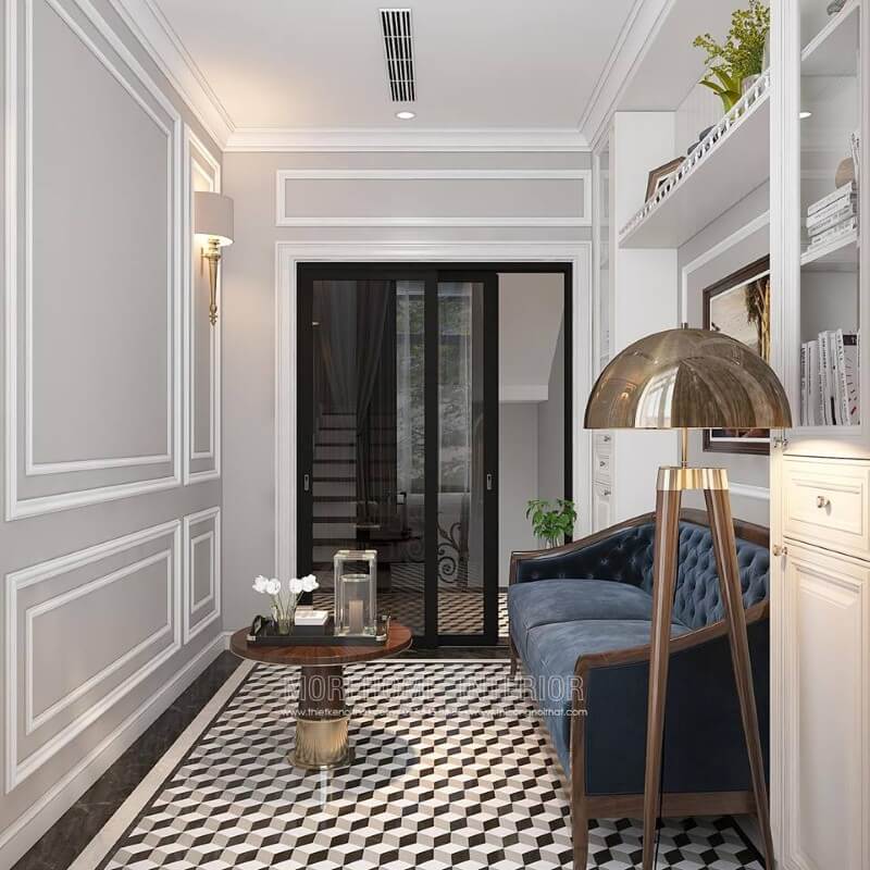 Gạch lát nền giả cổ, sofa đơn gỗ óc chó tân cổ điển bọc nệm xanh cùng tường trắng đơn sắc đã tạo nên không gian đẹp sang trọng, đáp ứng tối đa công năng cho phòng đọc sách. Thiết kế nội thất